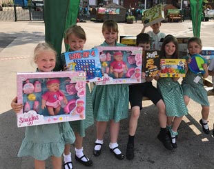 Children with gifts at Cale Green Primary School